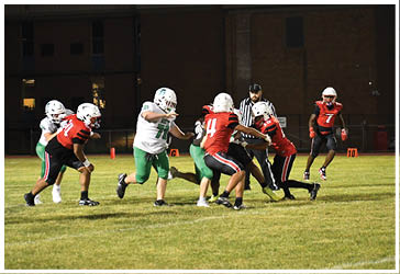 Two football players celebrating on the field. Description generated by AI
