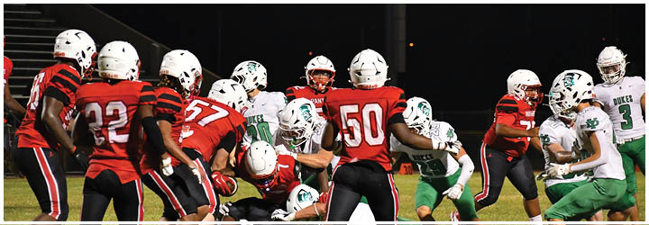 A group of football players on a field. Description generated by AI
