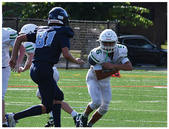 A group of football players on a field. Description generated by AI