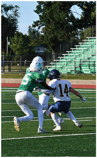 A football player catching a ball. Description generated by AI