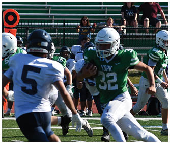 A football player catching a ball. Description generated by AI