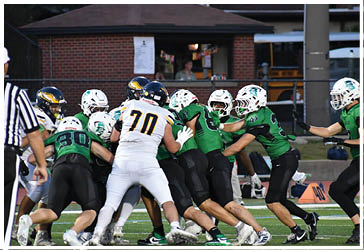 Two football players celebrating on the field. Description generated by AI