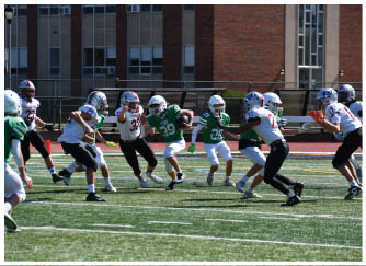 A football game is being played on a field. Description generated by AI