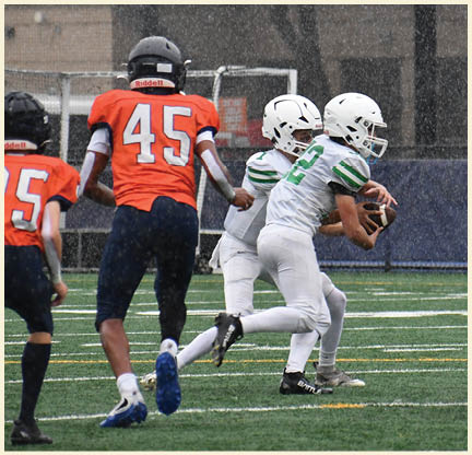 A football player is kicking a football on a field. Description generated by AI