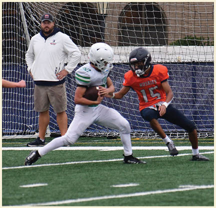 A football player is kicking a football on a field. Description generated by AI