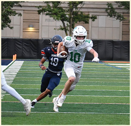 A football player is kicking a football on a field. Description generated by AI