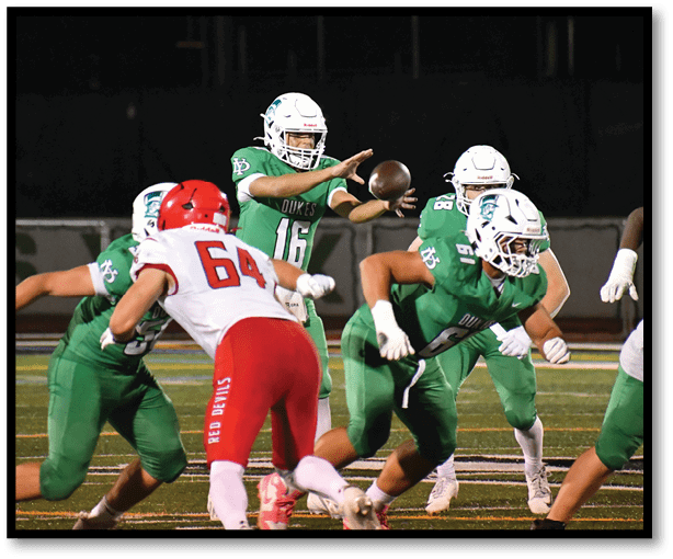 A group of football players wearing black jerseys with the number 3 on them. Description generated by AI