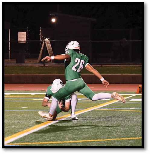 Two football players wearing black jerseys with the number 11 on them. Description generated by AI