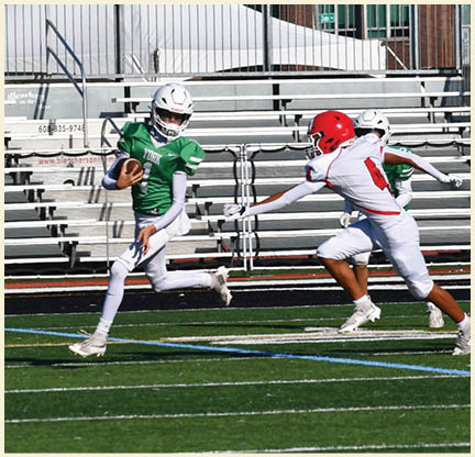 A football player is kicking a football on a field. Description generated by AI
