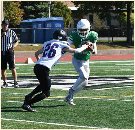 A football player is kicking a football on a field. Description generated by AI