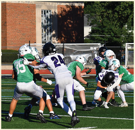 A football player is kicking a football on a field. Description generated by AI
