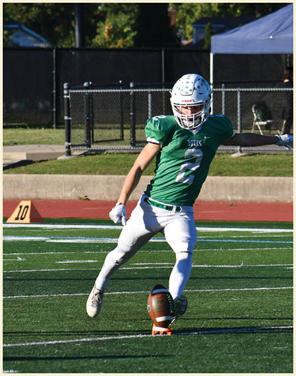 A football player wearing a black jersey with the number 11 on it. Description generated by AI