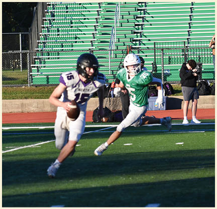 A football player is kicking a football on a field. Description generated by AI