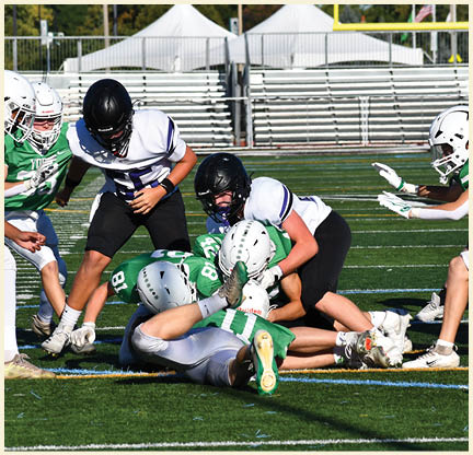 A football player is kicking a football on a field. Description generated by AI