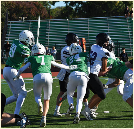 A football player is kicking a football on a field. Description generated by AI