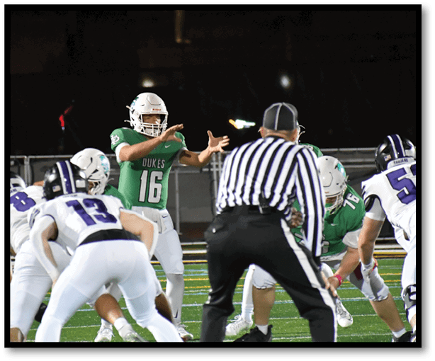 A group of football players wearing black jerseys with the number 3 on them. Description generated by AI