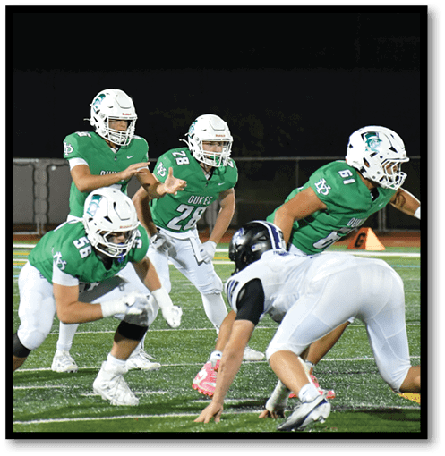 Two football players wearing black jerseys with the number 11 on them. Description generated by AI