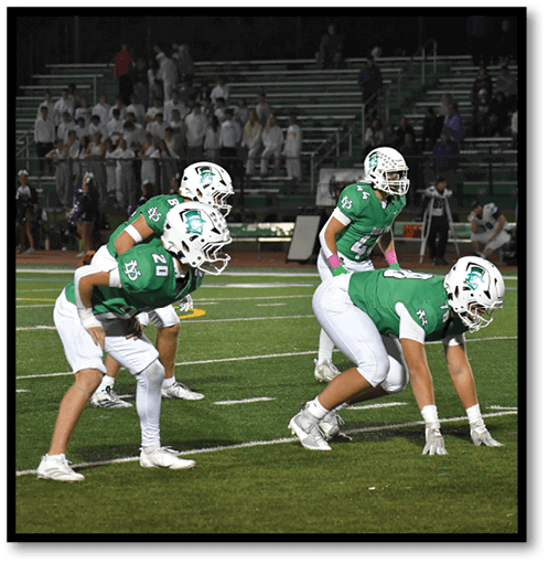 A group of men wearing black and white jerseys. Description generated by AI