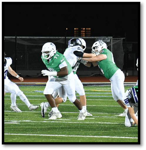 Two football players wearing black jerseys with the number 11 on them. Description generated by AI