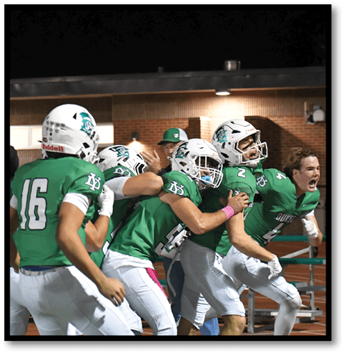Two football players wearing black jerseys with the number 11 on them. Description generated by AI