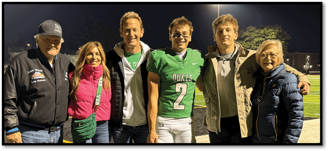 A group of football players on a field. Description generated by AI