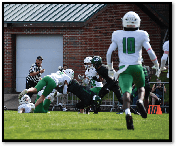 A group of football players wearing black jerseys with the number 3 on them. Description generated by AI