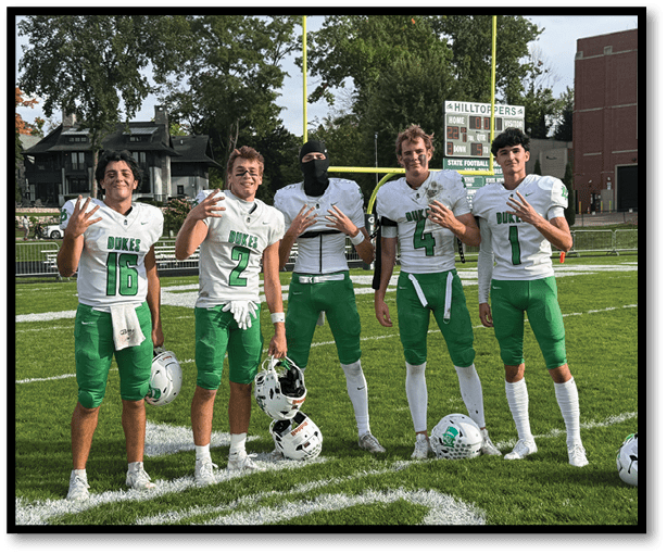 A group of football players wearing black jerseys with the number 3 on them. Description generated by AI