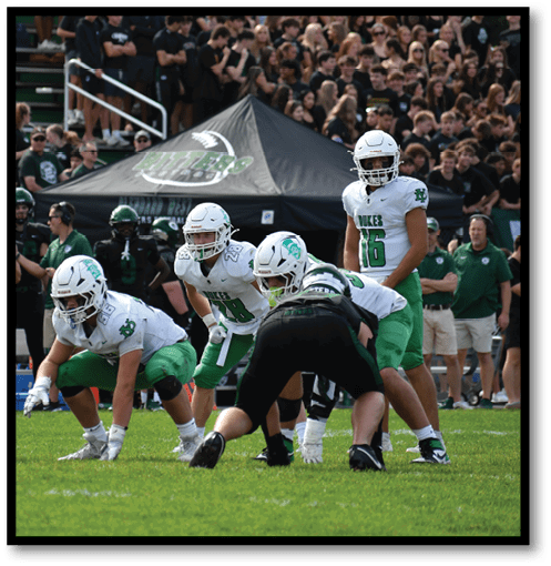 Two football players wearing black jerseys with the number 11 on them. Description generated by AI