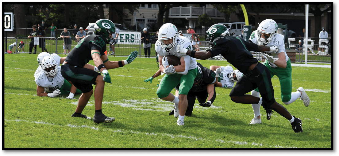 A football player running on the field. Description generated by AI