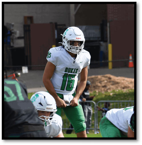 Two football players wearing black jerseys with the number 11 on them. Description generated by AI