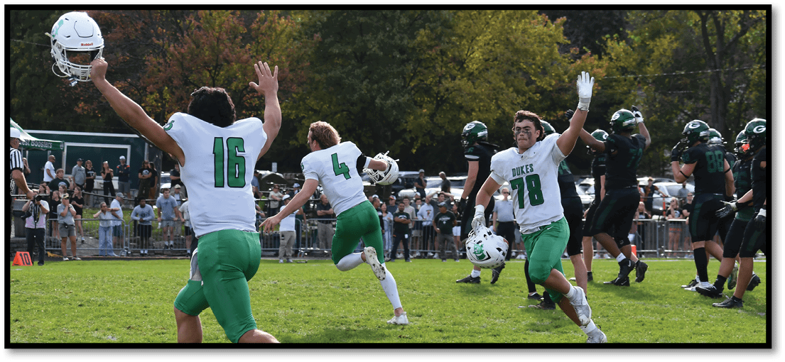 A group of football players on a field. Description generated by AI