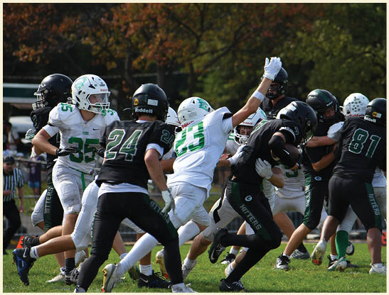A football player is kicking a football on a field. Description generated by AI