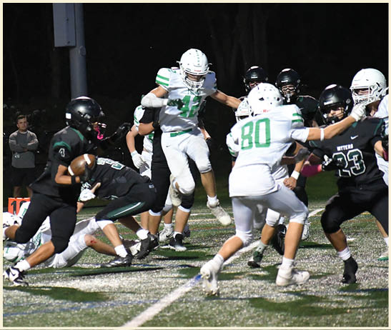 A football player is kicking a football on a field. Description generated by AI