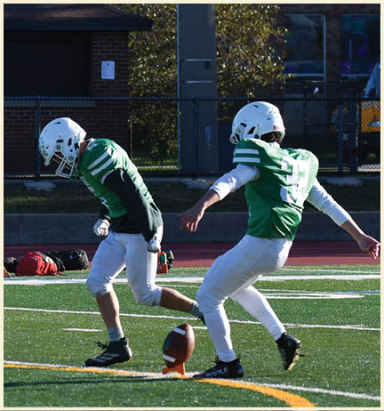 A football player wearing a black jersey with the number 11 on it. Description generated by AI