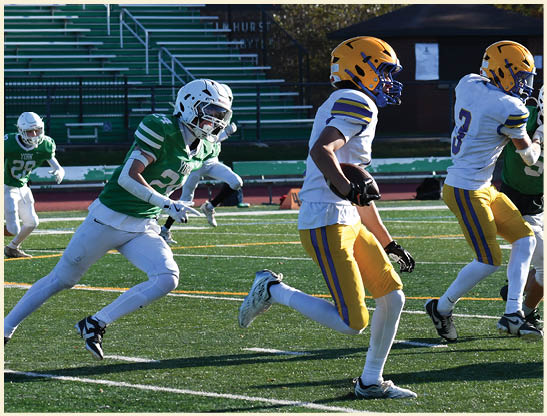 A football player is kicking a football on a field. Description generated by AI