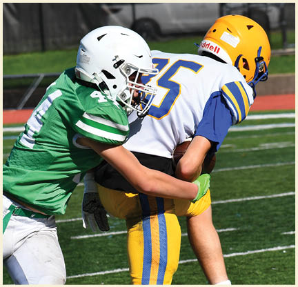 A football player wearing a black jersey with the number 11 on it. Description generated by AI
