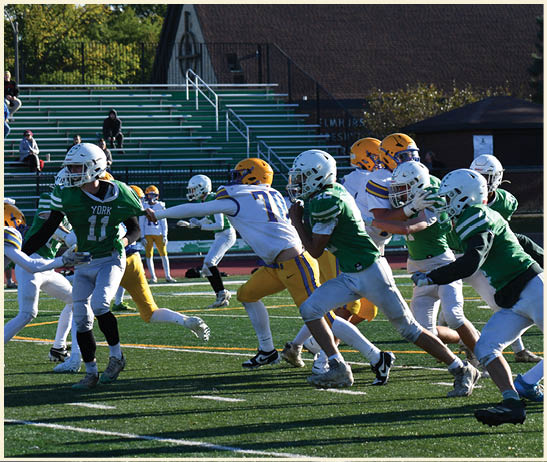A football player is kicking a football on a field. Description generated by AI