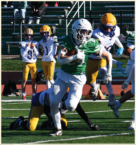 A football player wearing a black jersey with the number 11 on it. Description generated by AI
