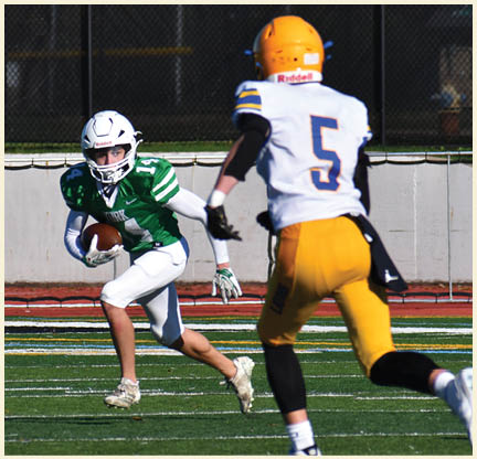 A football player wearing a black jersey with the number 11 on it. Description generated by AI