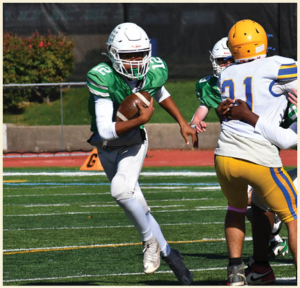A football player wearing a black jersey with the number 11 on it. Description generated by AI