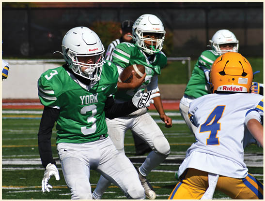 A football player is kicking a football on a field. Description generated by AI