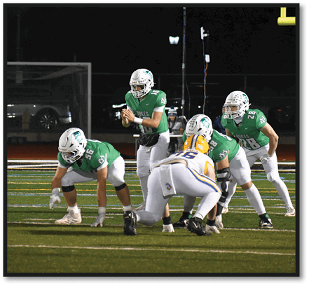 A group of football players wearing black jerseys with the number 3 on them. Description generated by AI