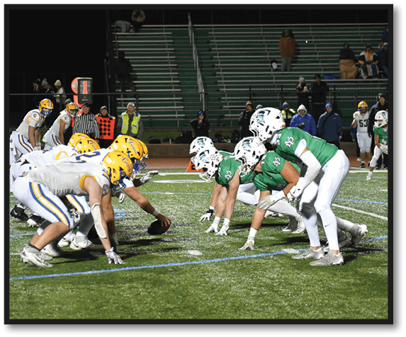 A group of football players wearing black jerseys with the number 3 on them. Description generated by AI
