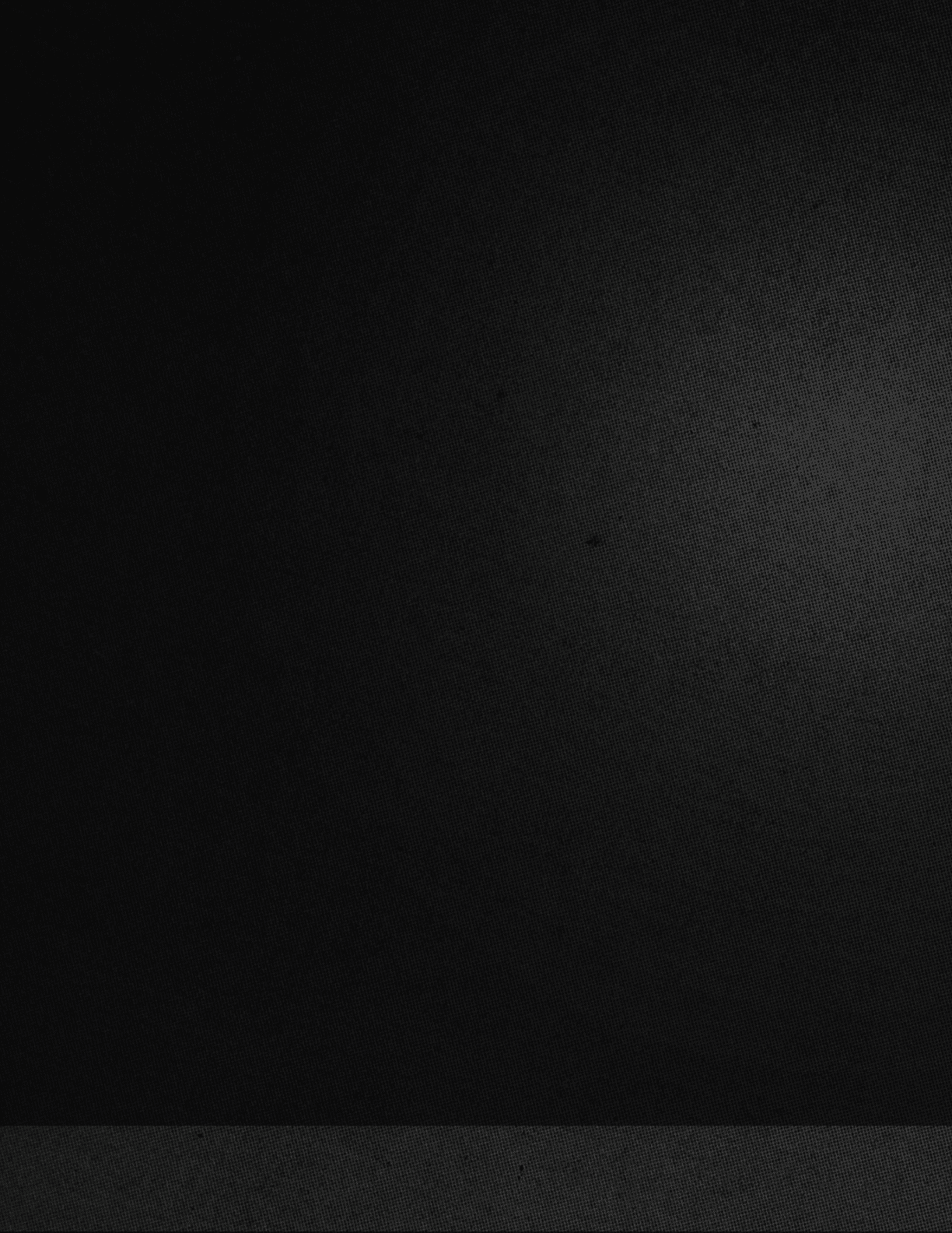 A yellowish-brown sky with a few clouds. Description generated by AI