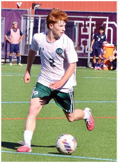 A football player wearing a blue and red jersey. Description generated by AI