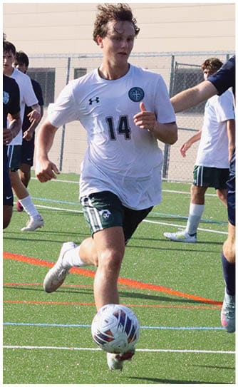 A football player catching a ball. Description generated by AI