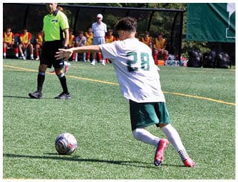 A group of football players on a field. Description generated by AI