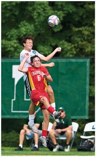 A football player catching a ball. Description generated by AI