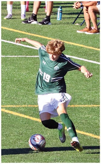 A football player catching a ball. Description generated by AI