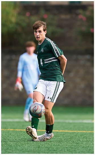A football player catching a ball. Description generated by AI